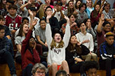 Students cheering in the stands. Links to Gifts from Retirement Plans