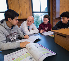 Teacher talking with students. Link to Life Stage Gift Planner Over Age 65 Situations.